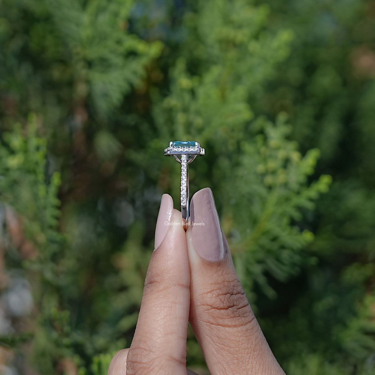 Side View of Round Moissanite Three Stone Bezel Set Ring