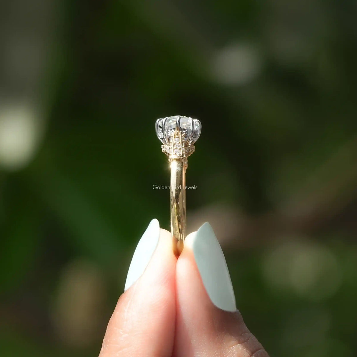 Side View of Step Cut Marquise Shape Hidden Halo Moissanite Ring In two fingers