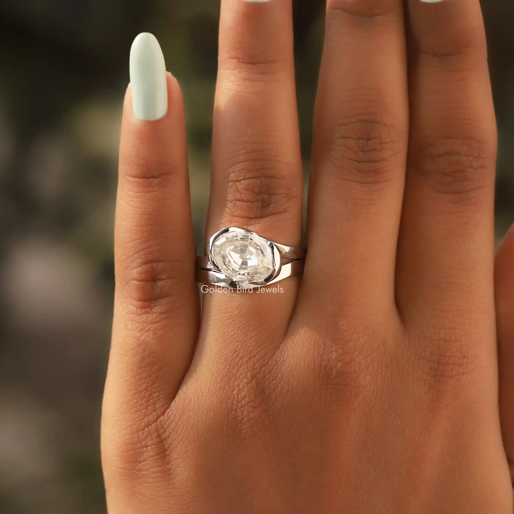 Detailed View Of Step Cut Oval Moissanite Bypass Ring In White Gold