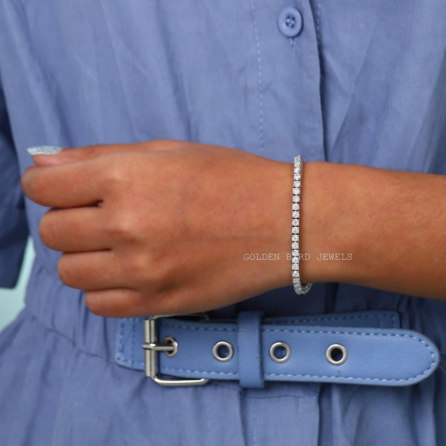 On hand front view of round cut moissanite bracelet made in prong setting
