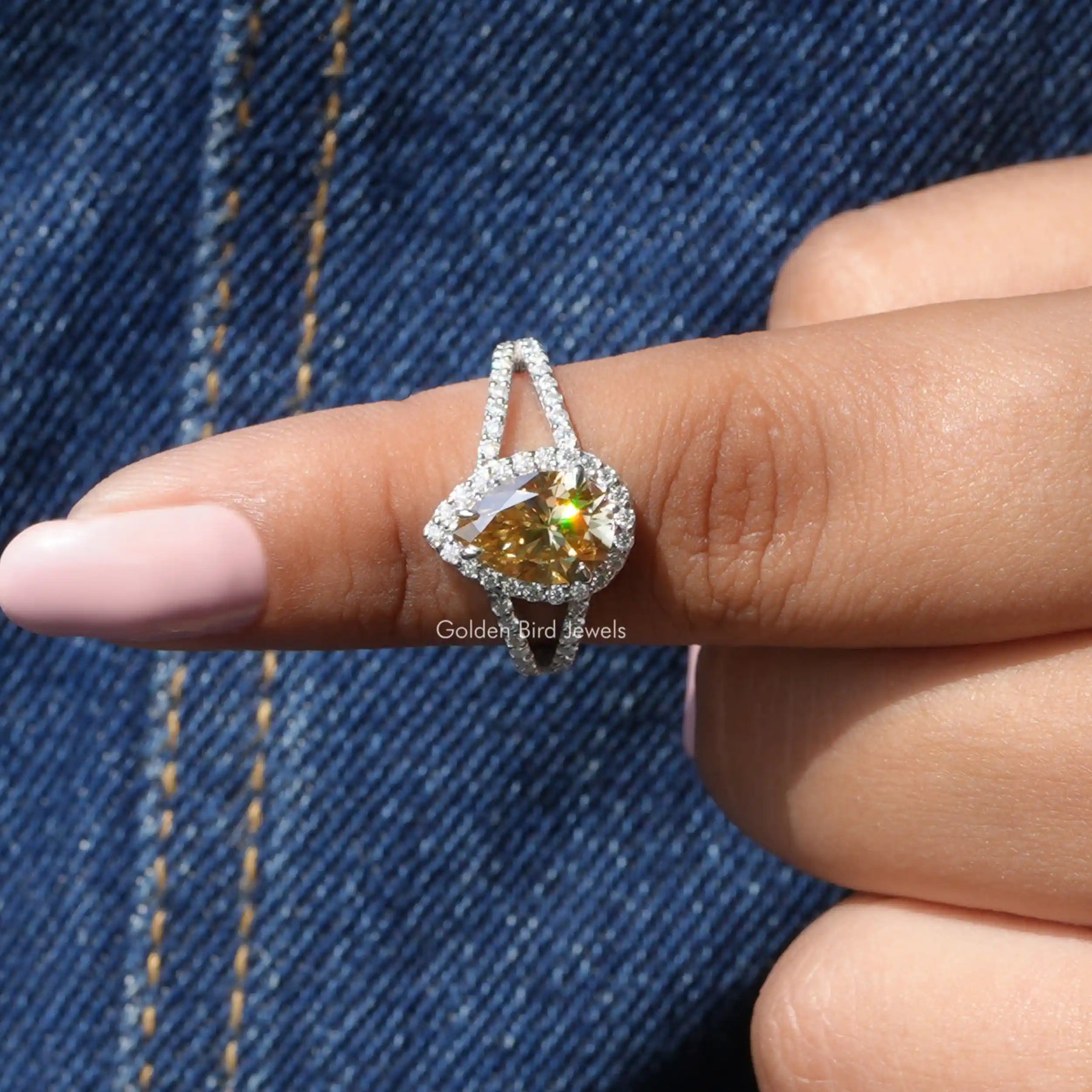 In finger front View of Pear and Round Cut Halo Engagement Ring