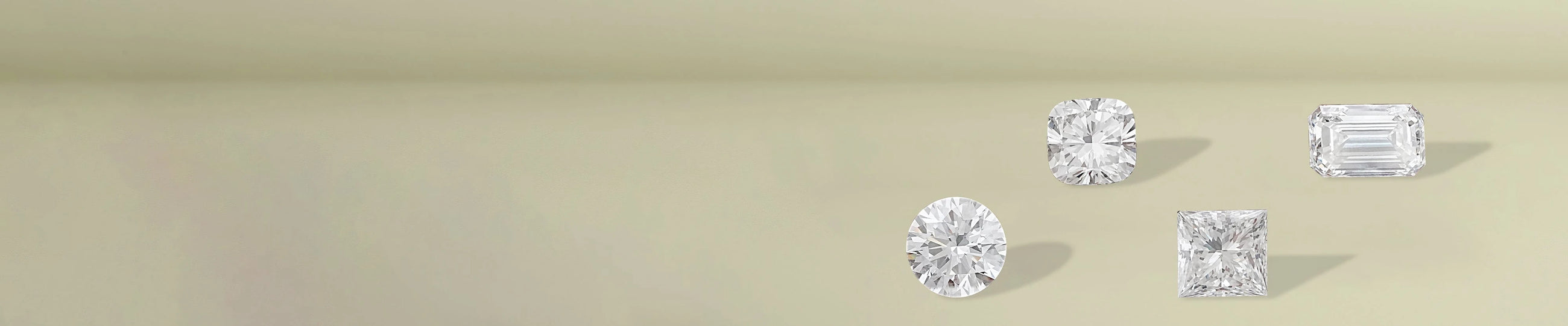 Round brilliant cut diamonds displayed on soft beige fabric surface