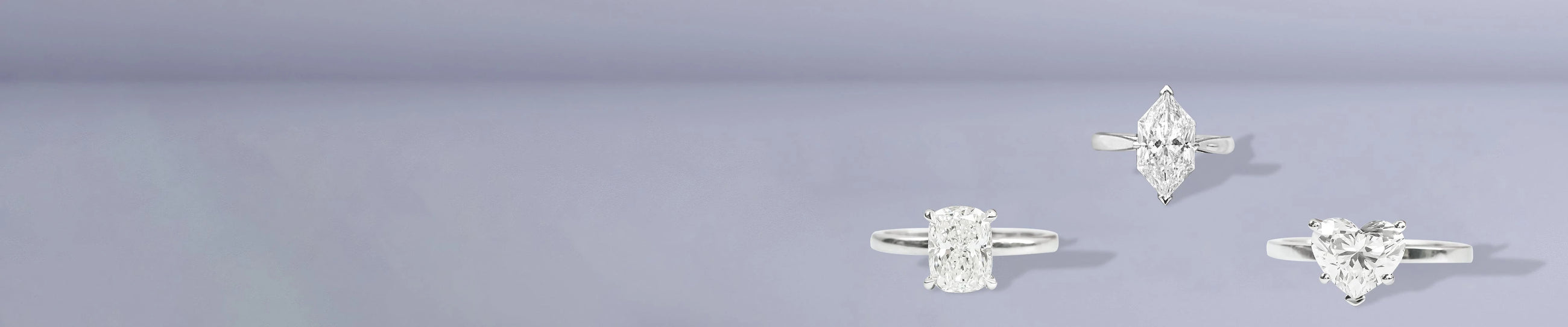 Fancy shape solitaire rings with cushion, marquise and heart diamonds on lavender background