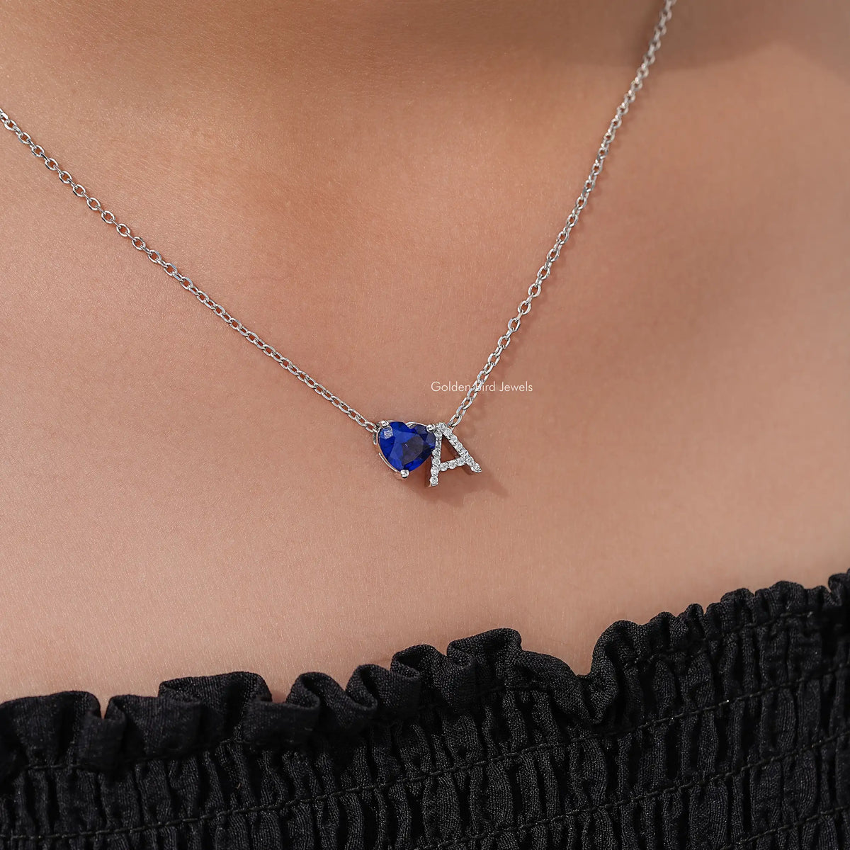 Blue heart gemstone initial pendant necklace with silver chain and letter A charm