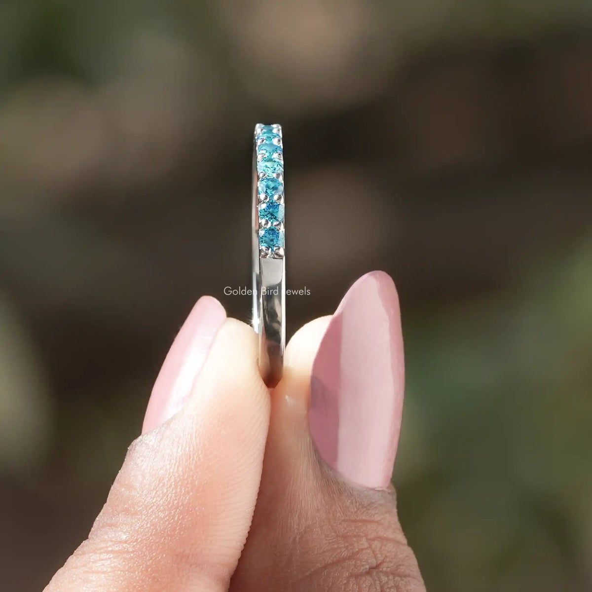 Side View of Aquamarine Blue Round Gemstone Eternity Band