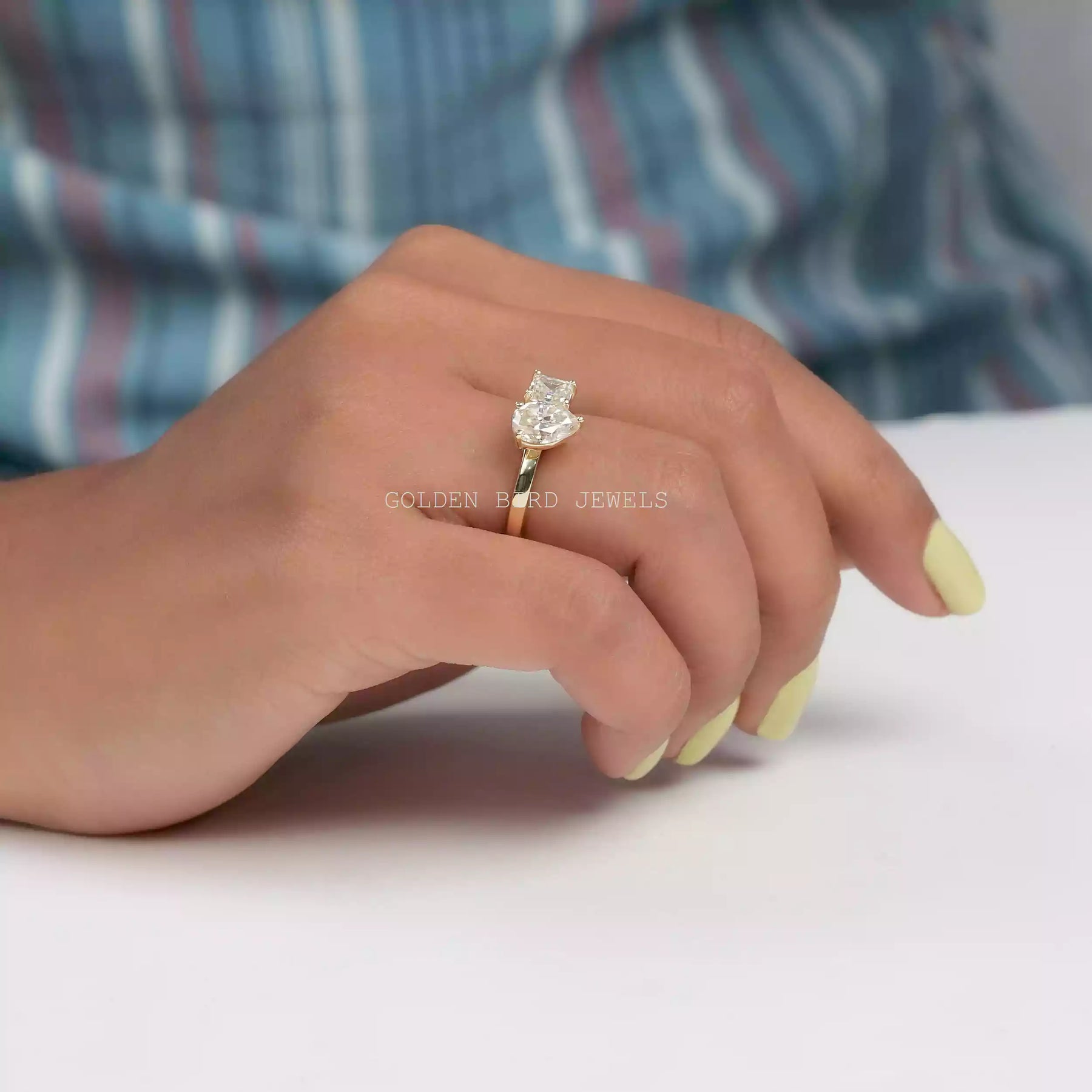  In finger Side view of moissanite  ring holding on two fingers 