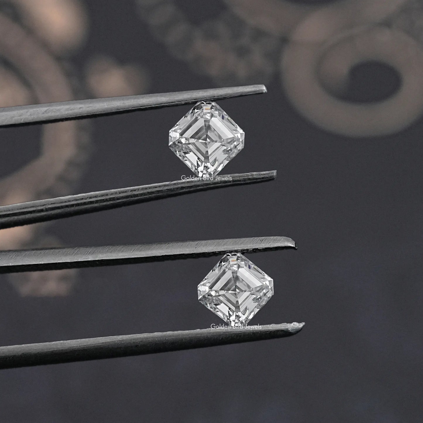Tweezer holding the Asscher Cut Lab Grown Diamond Pair