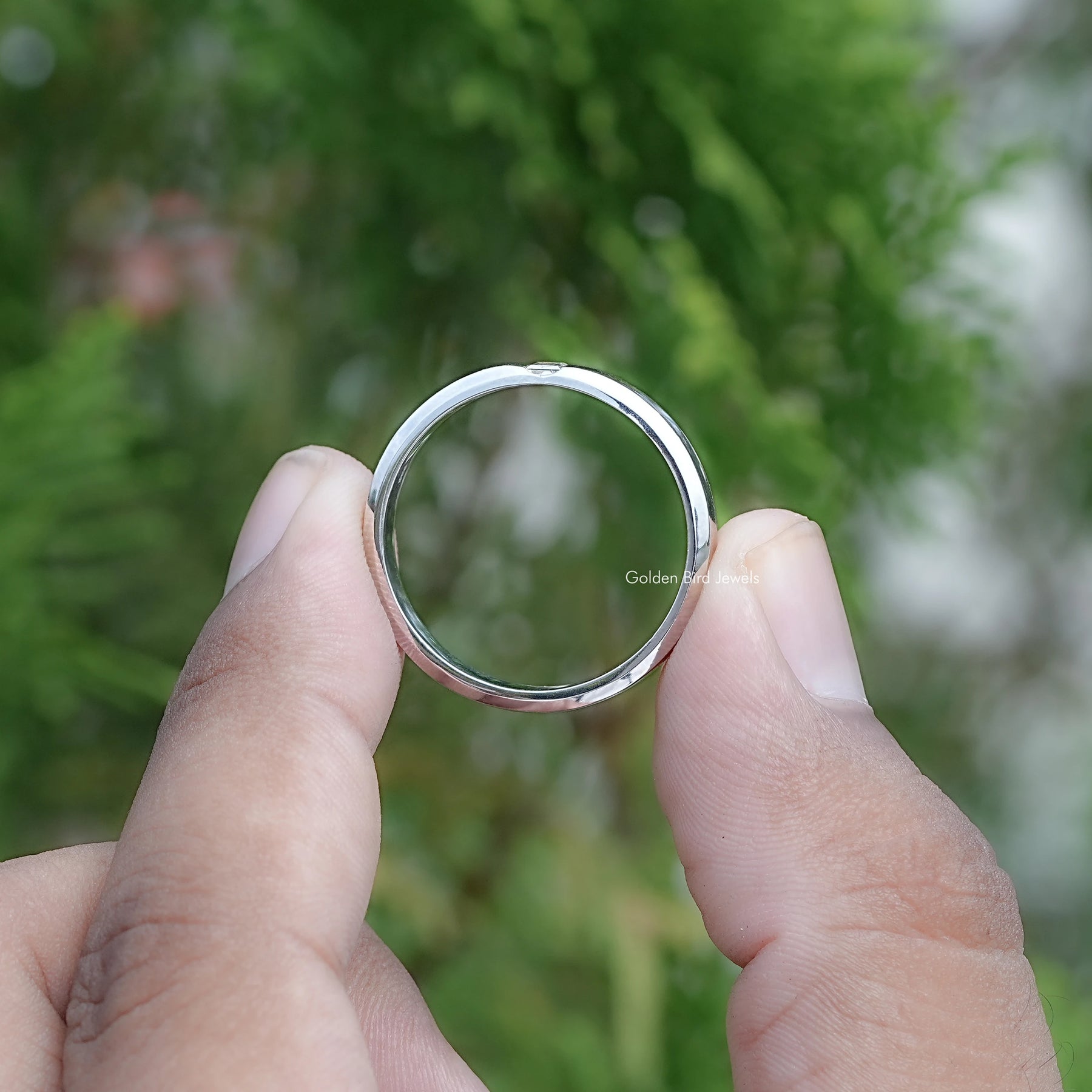 Back view of Baguette Cut Moissanite Solitaire Ring in secure setting 
