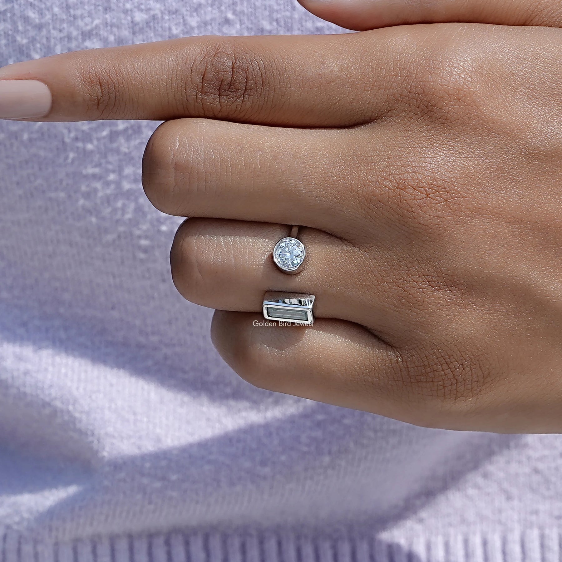 Close view of moissanite ring in secure setting 
