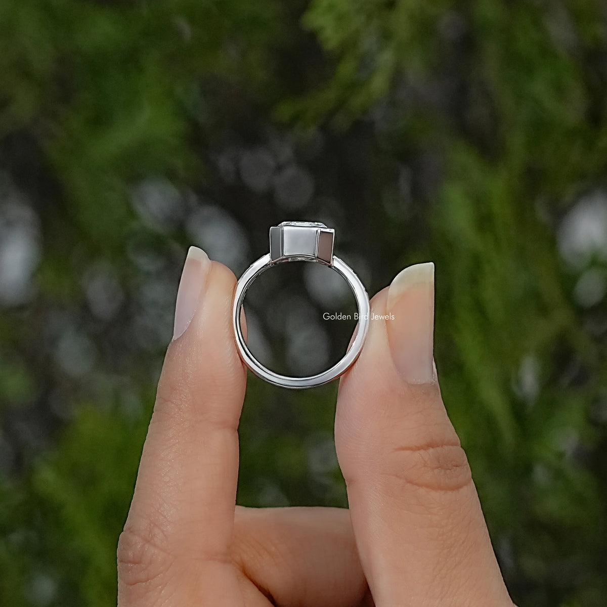Side view of the sterling silver ring, showing the raised setting and smooth band