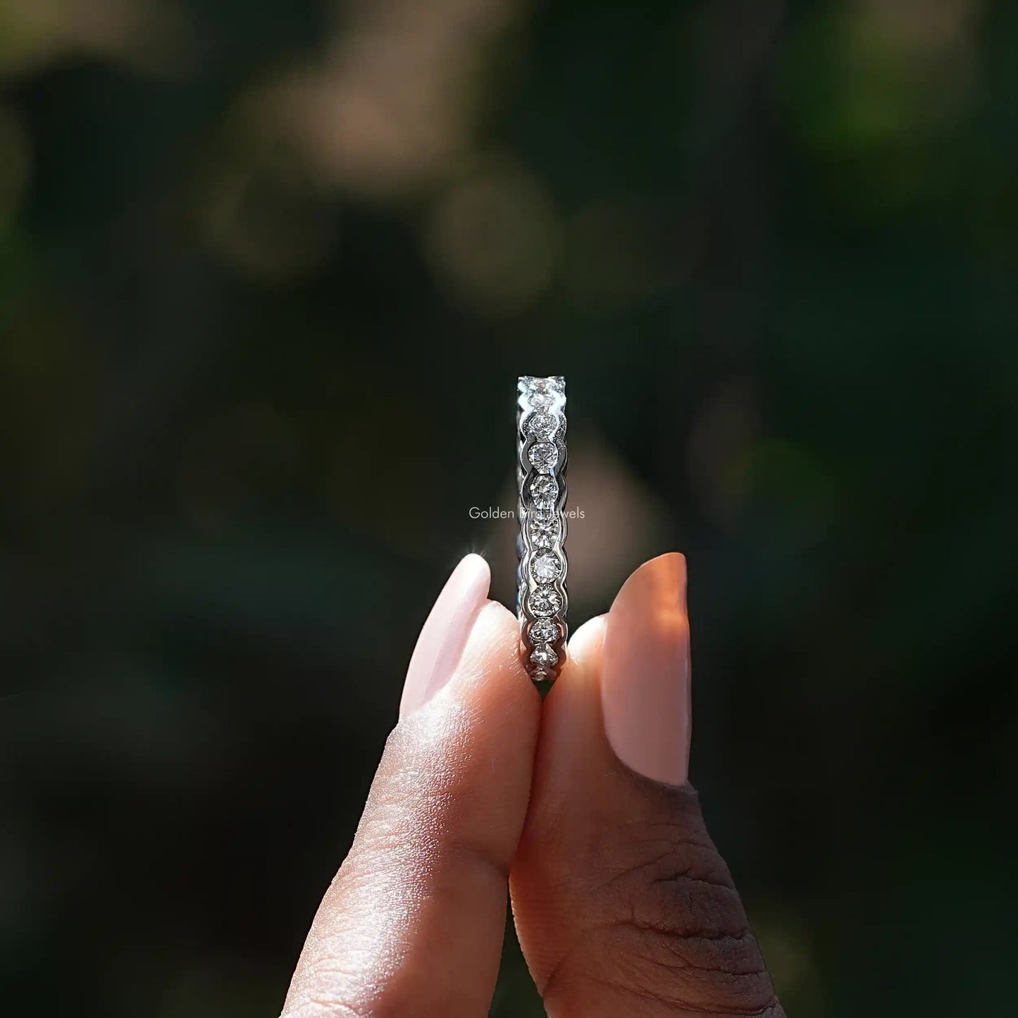 Side View of Round Diamond Wedding Band In two fingers