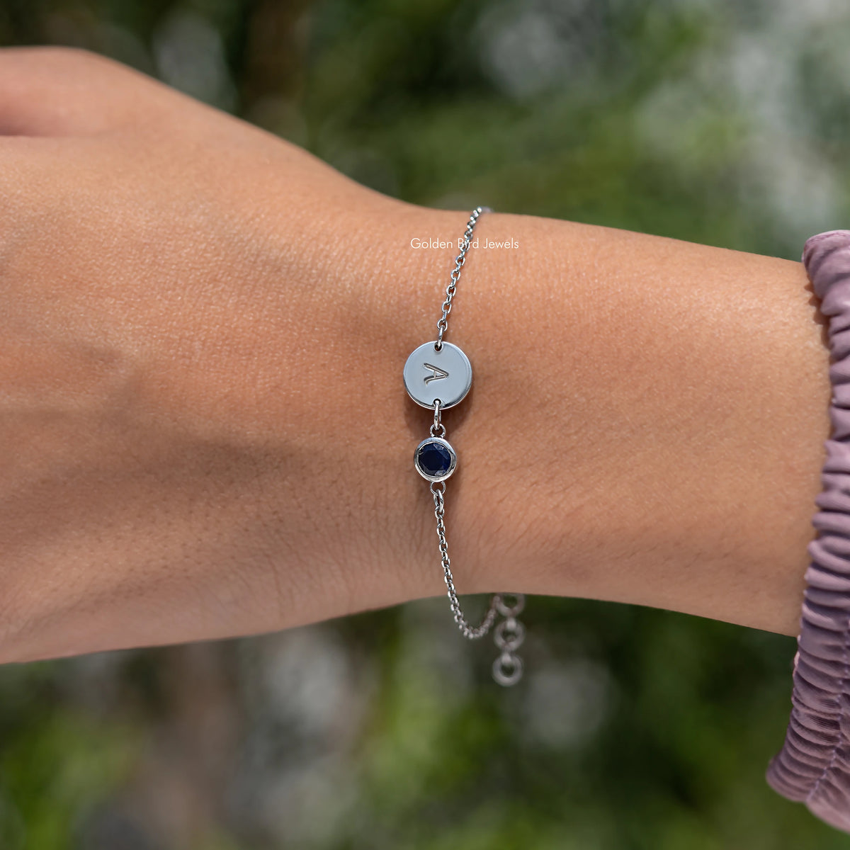 Sterling silver bracelet with letter A charm and round blue gemstone