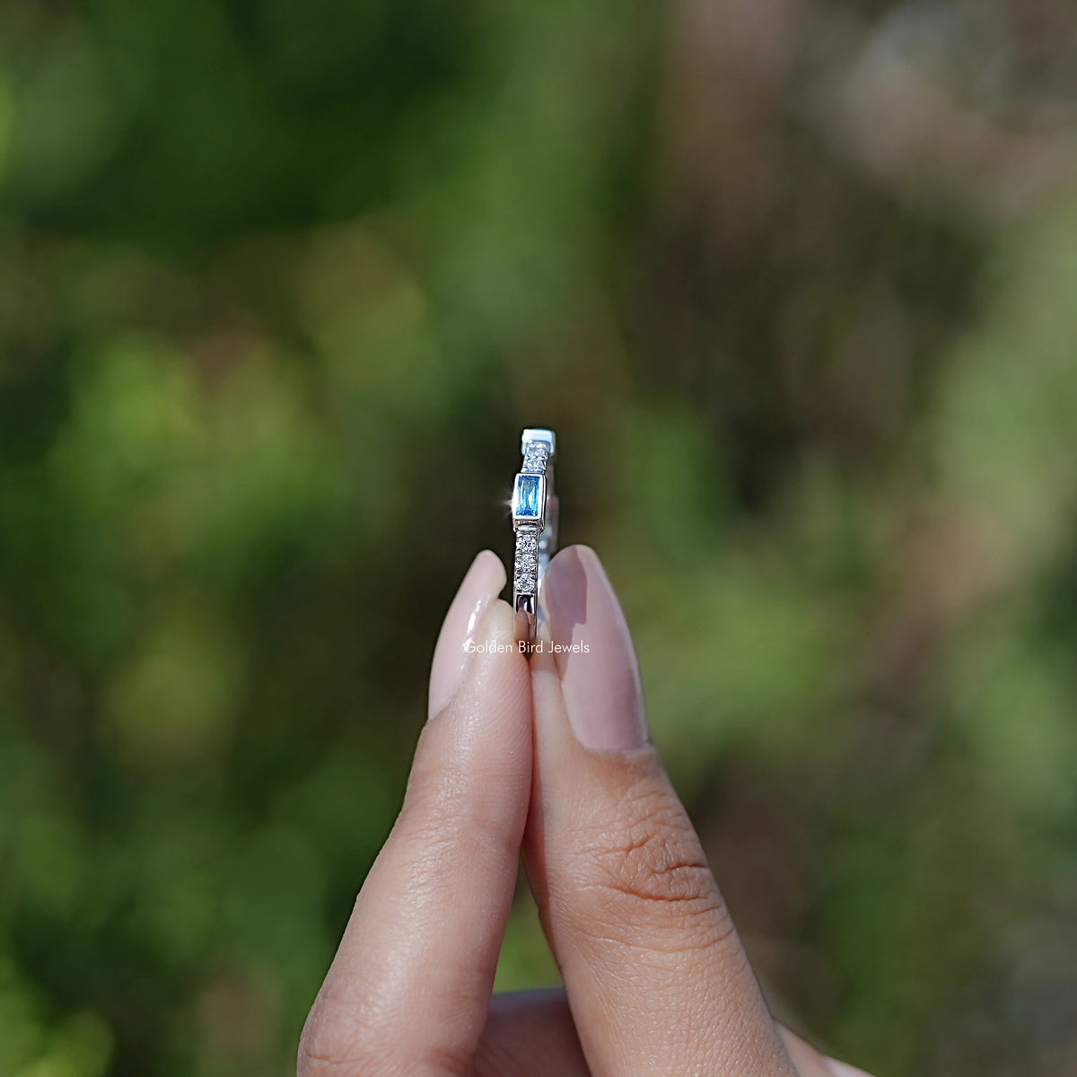 Side View Of Blue Baguette Gemstone Eternity Band