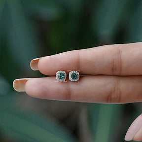 In two finger view of Stud earrings crafted in moissanite 