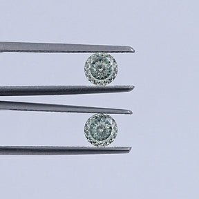 In Tweezer View Of Portuguese Cut Loose Moissanite Pair