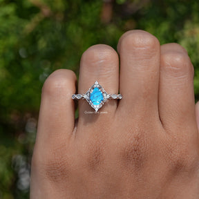 Detailed View of Pear Cut Gemstone Accent Ring In White Gold