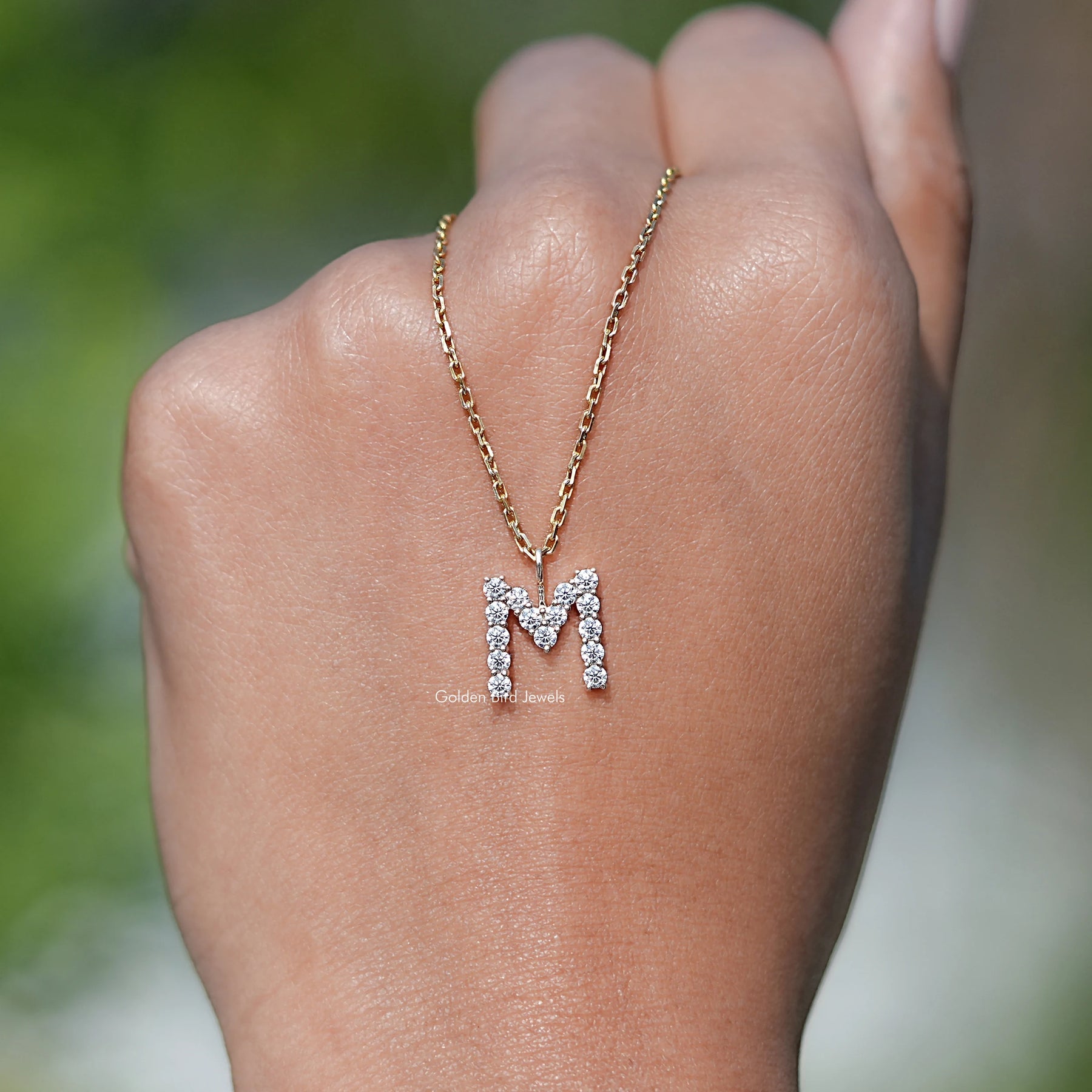 In hand Showing View Of Moissanite Solitaire pendant 