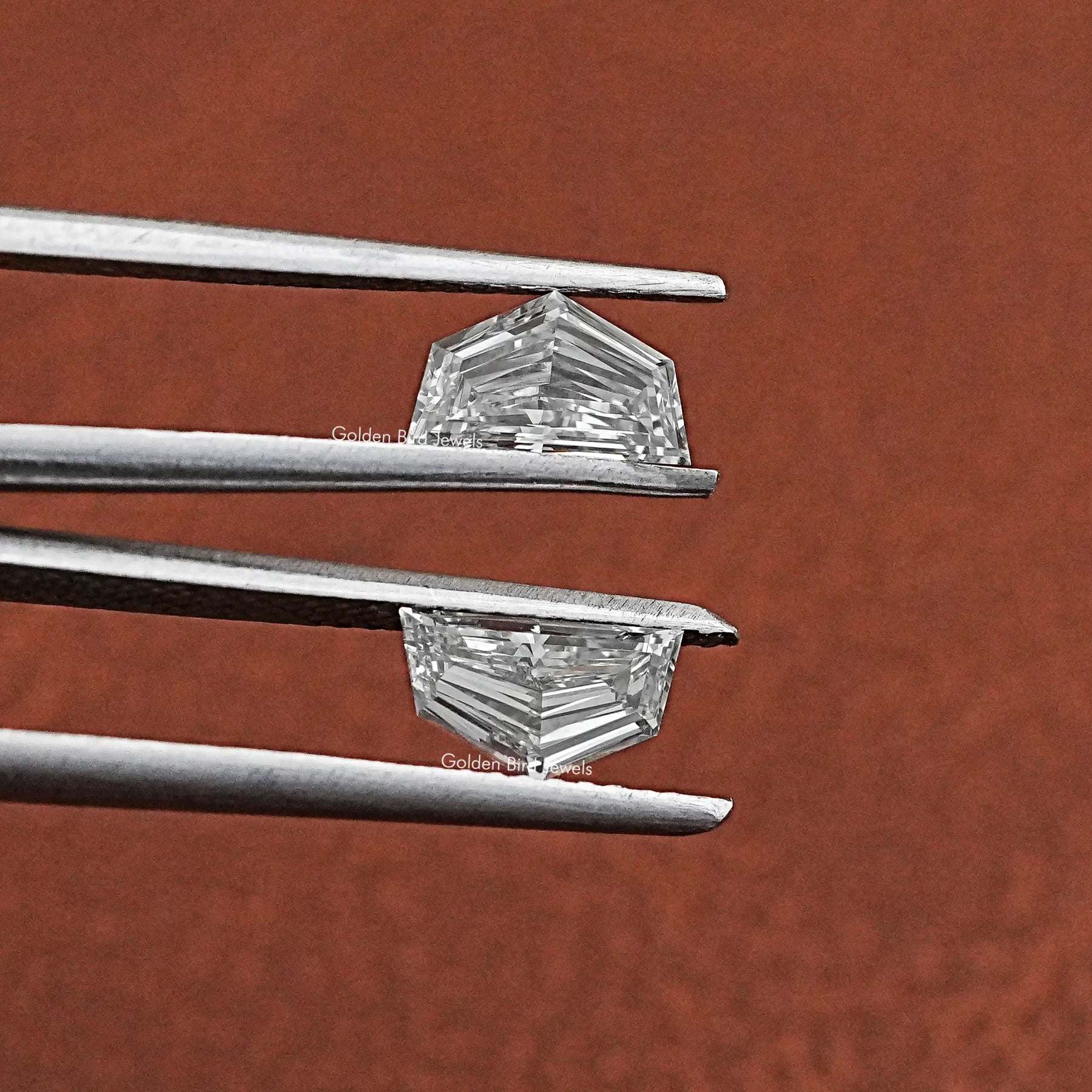Tweezer holding Cadillac Shaped Lab Grown Matching Pair