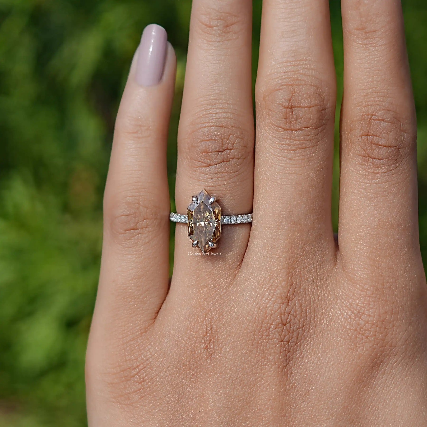 Finger front view of Marquise cut engagement ring