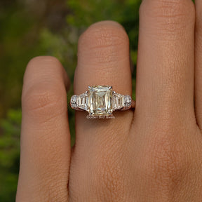 Criss And Trapezoid Cut Three Stone Engagement Ring