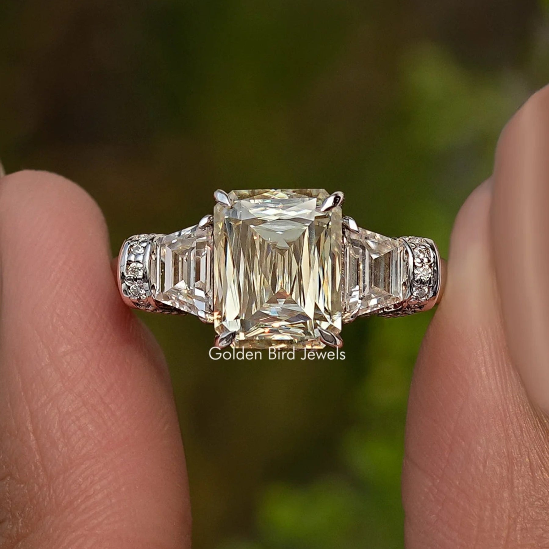 Criss And Trapezoid Cut Three Stone Engagement Ring