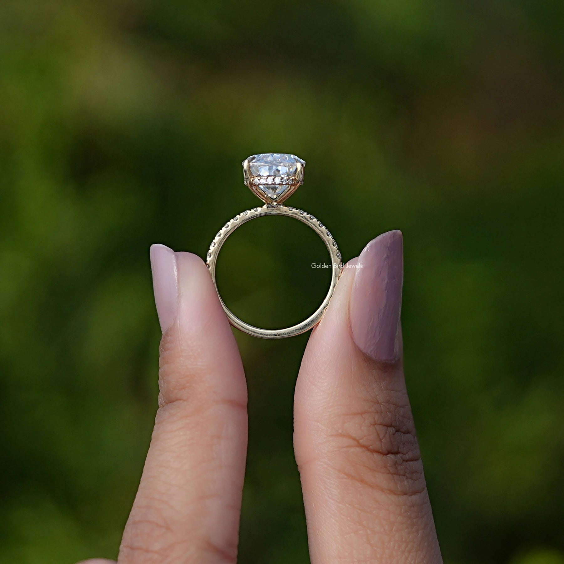 Back View of Crushed Ice Oval Moissanite Solitaire Ring In two fingers