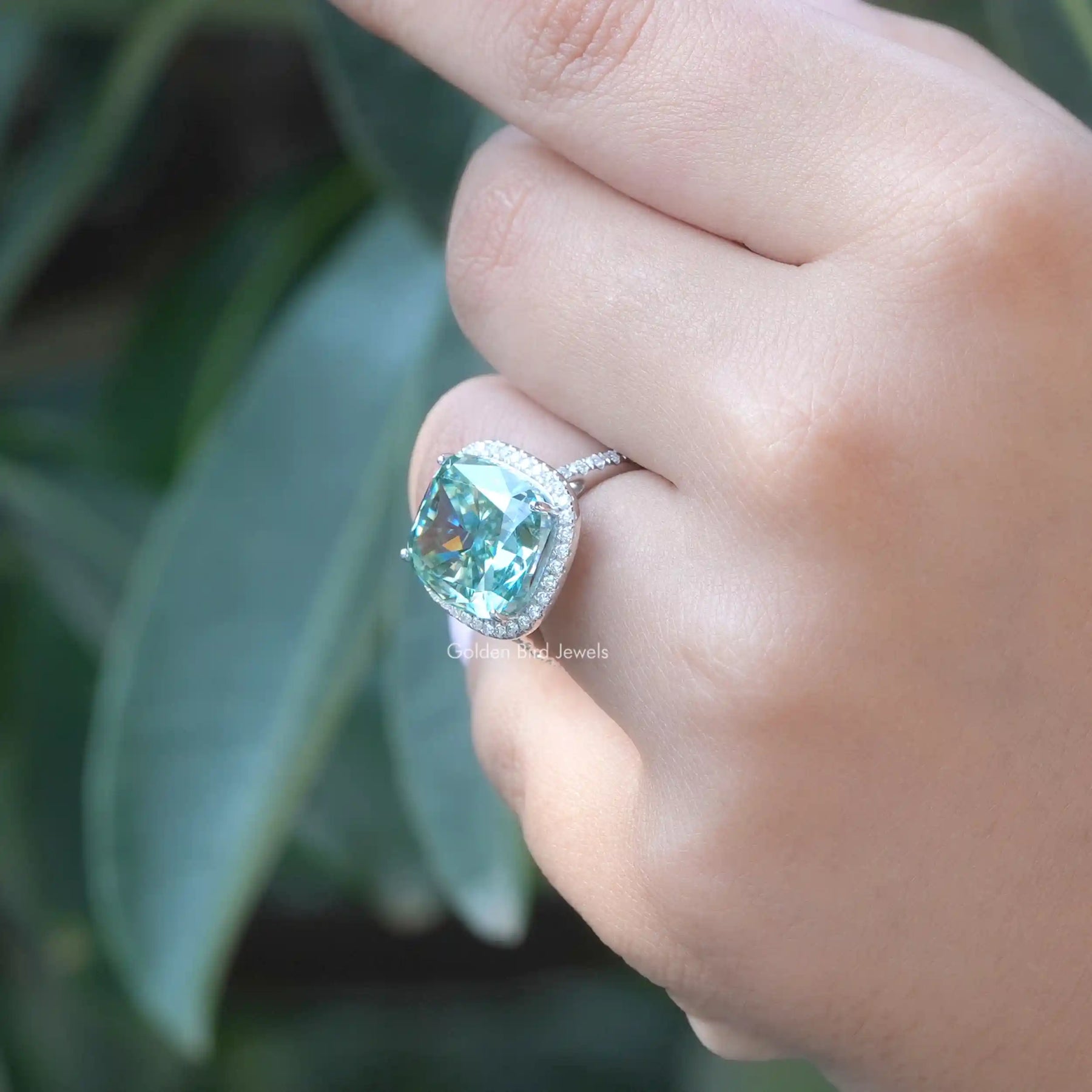 View of Blue Cushion Cut Moissanite Halo Engagement Ring In White Gold
