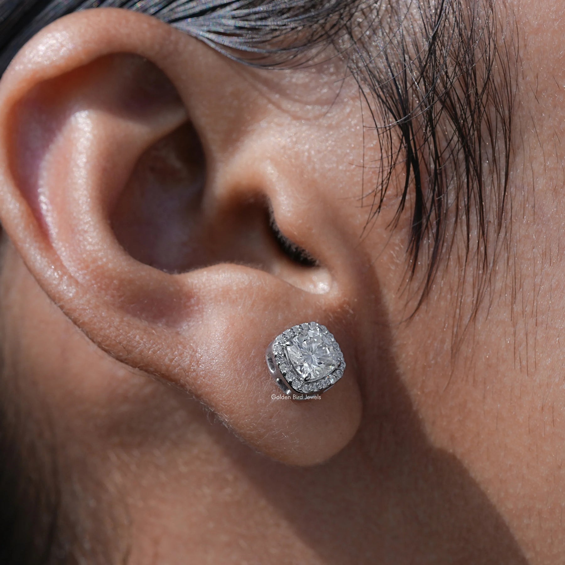 Side view of cushion cut solitaire earrings 