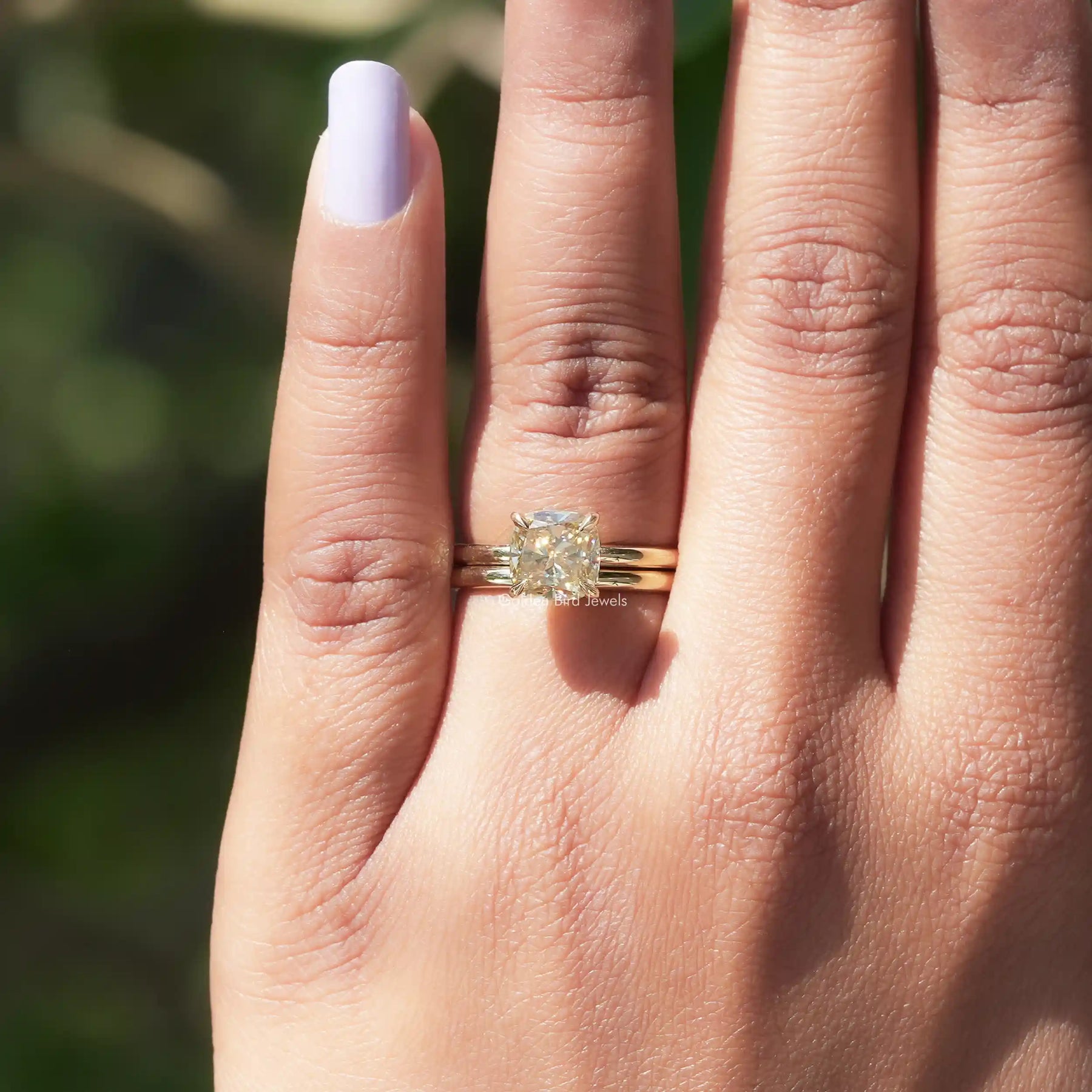 In finger Top View of moissanite cushion cut Diamond ring