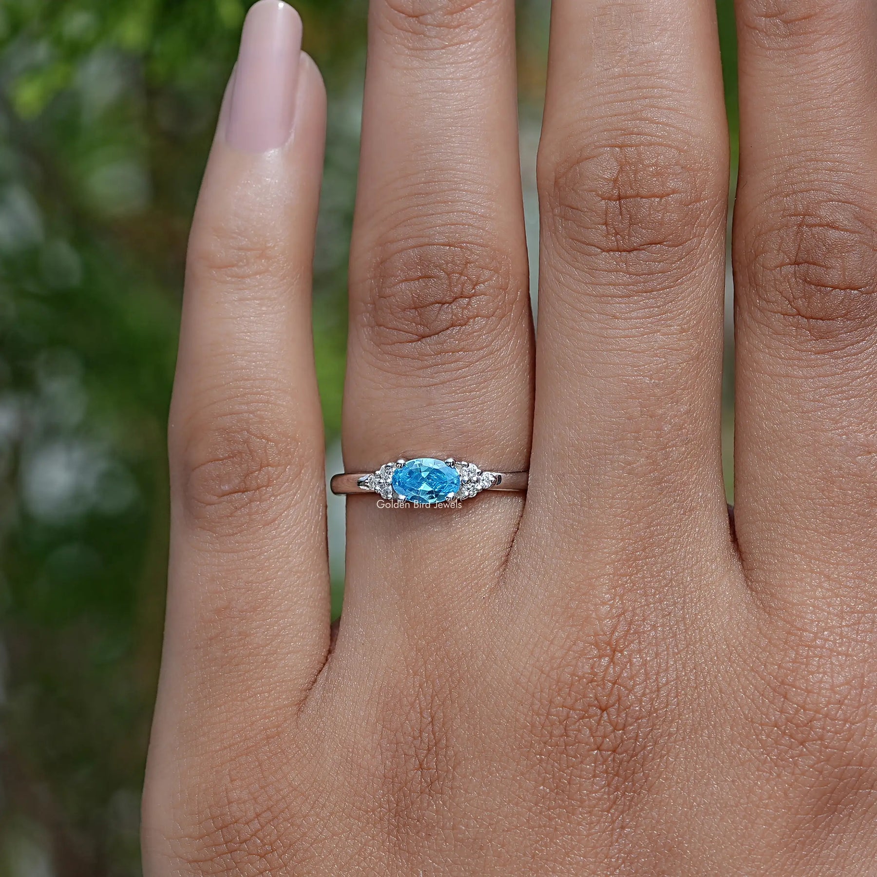 Oval Cut East West Gemstone Ring In finger