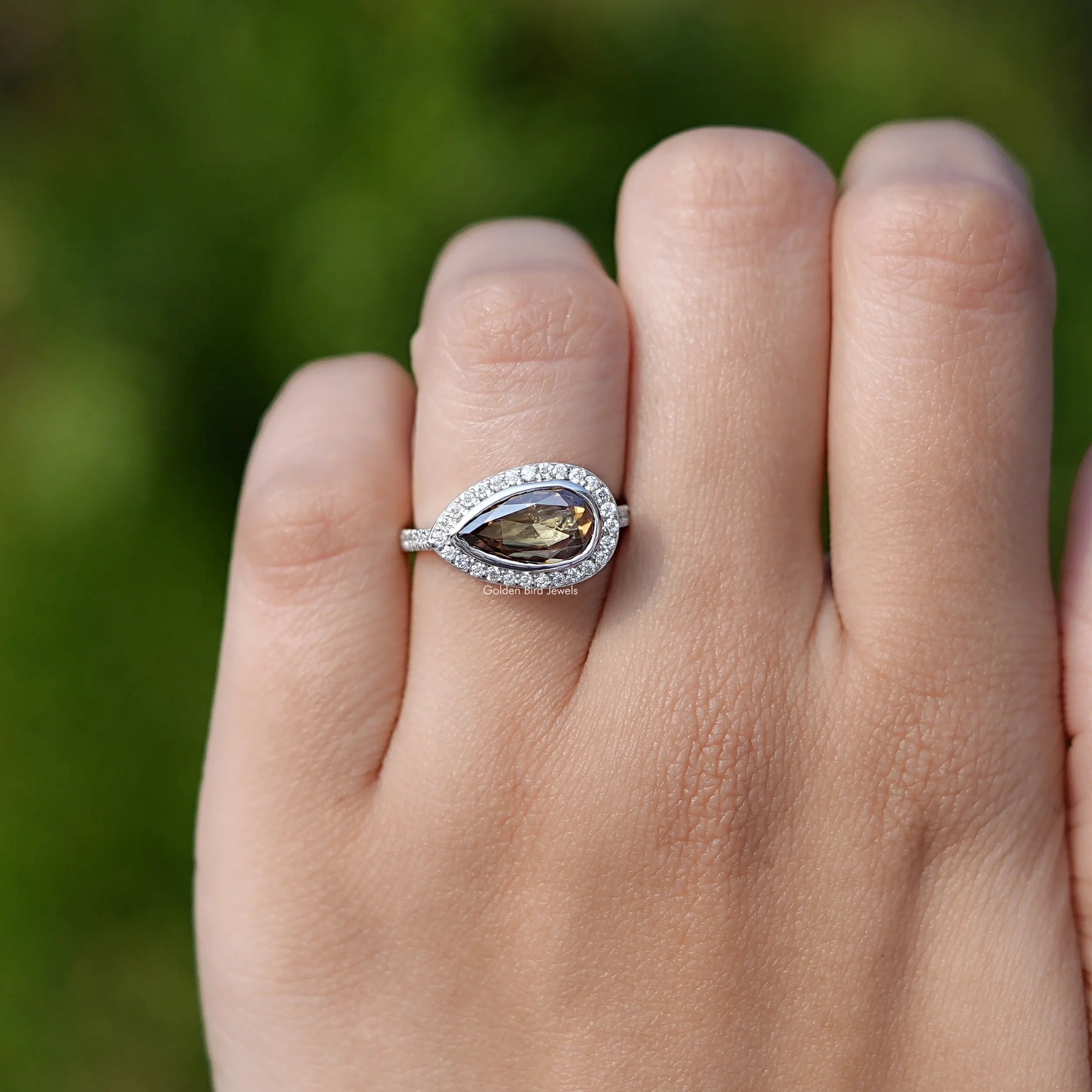 Pear Cut Moissanite Halo Ring In White Gold