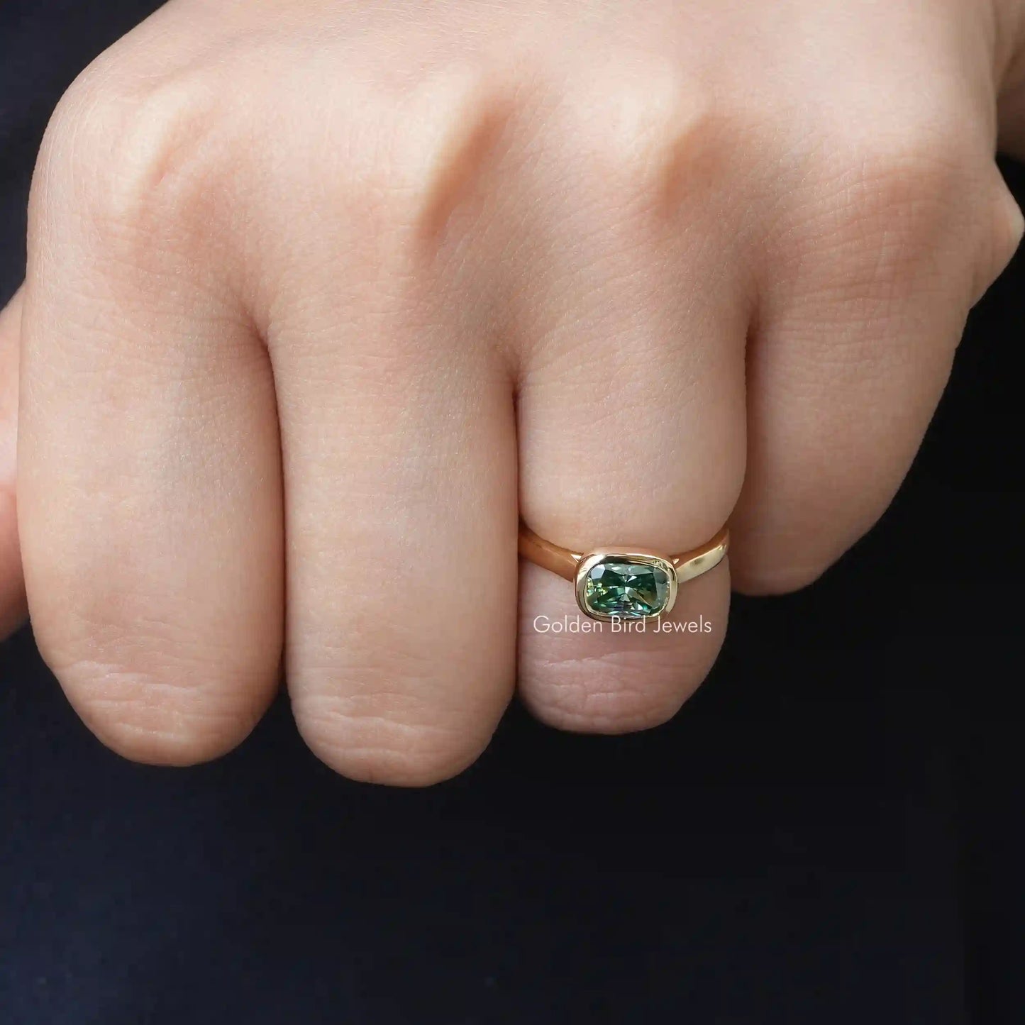 Detailed View Of Colored Cushion Cut Moissanite Engagement Ring In Yellow Gold