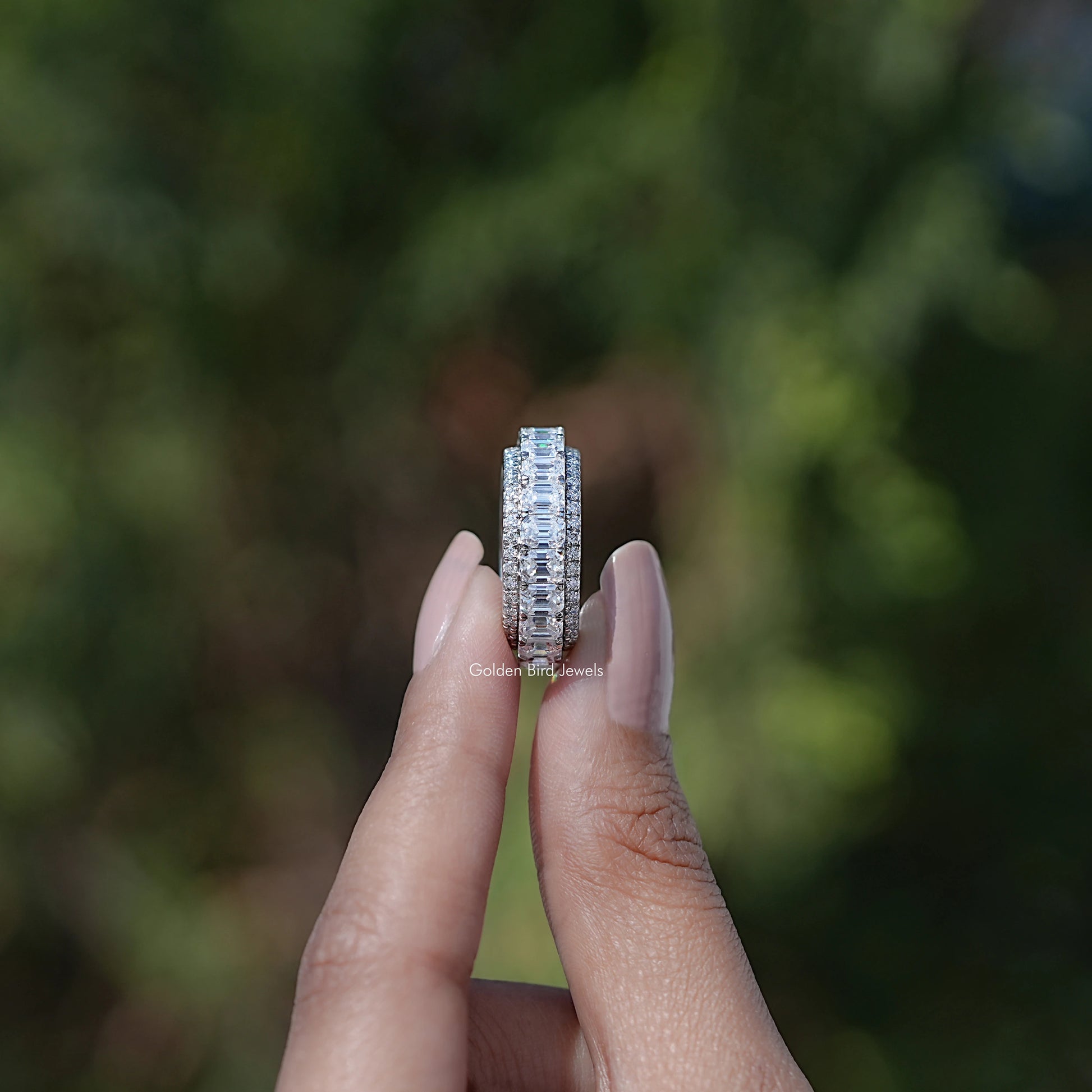 Side View of Emerald and Round Cut moissanite three row band