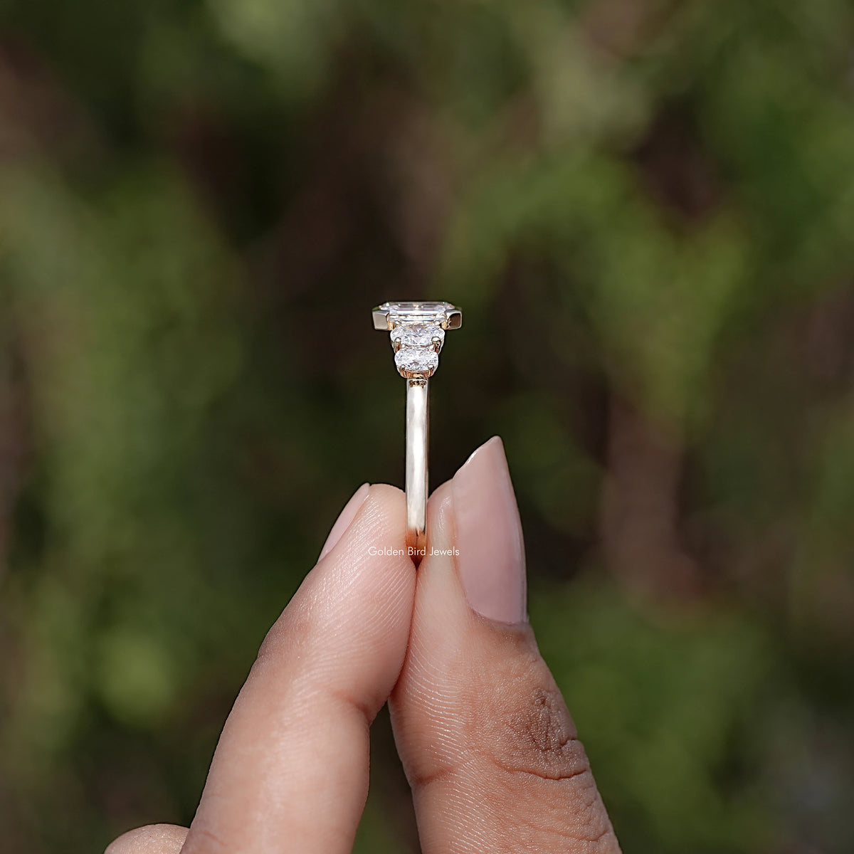 Side View of Pear And Baguette Cut Diamond Five Stone Ring