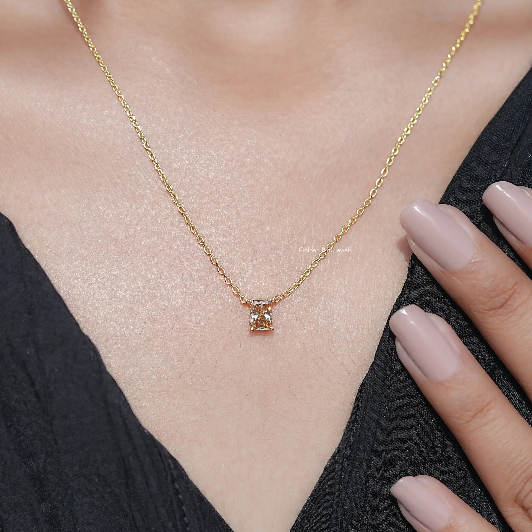 View of Emerald Cut Moissanite Solitaire Ring in prongs setting 