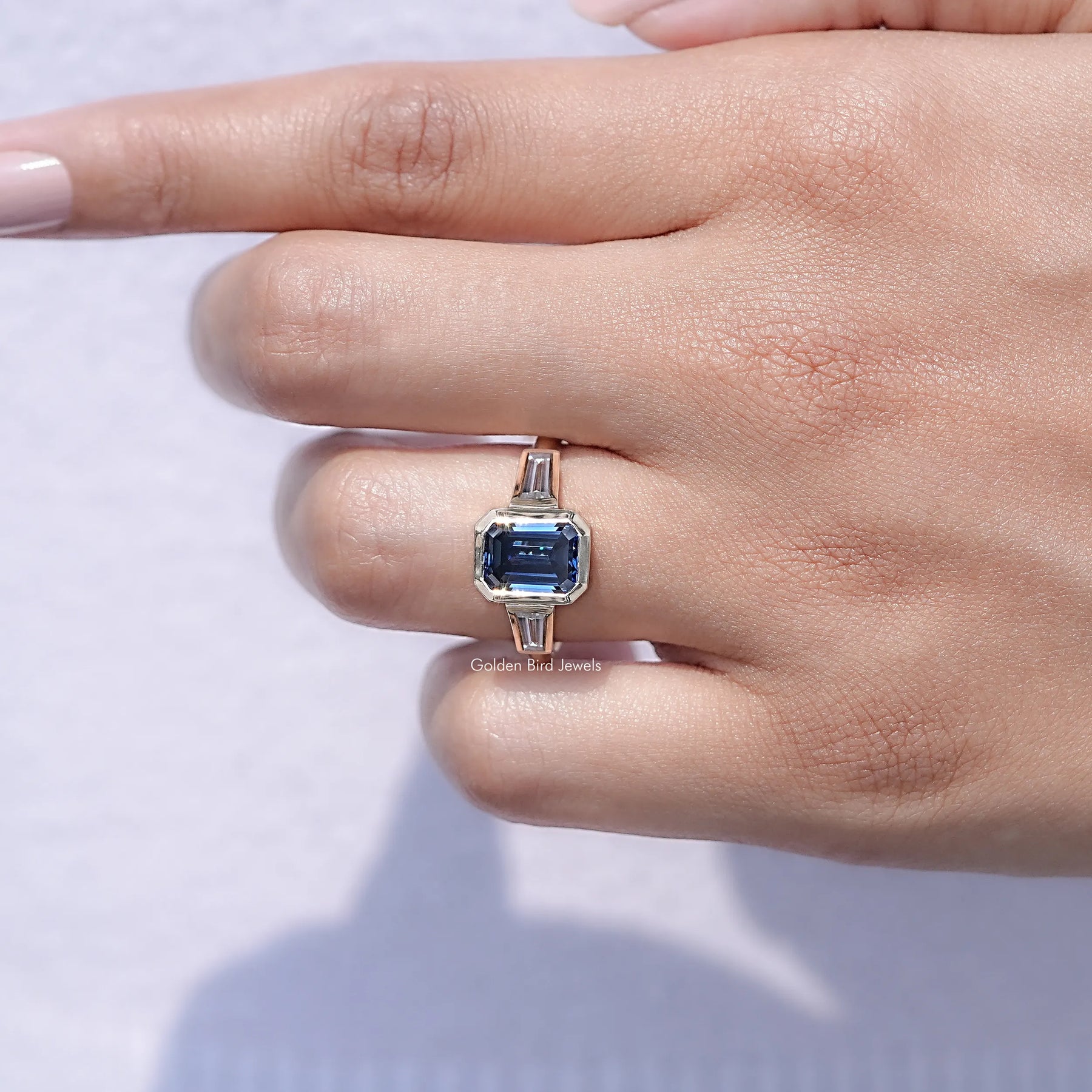 View of Moissanite Emerald Engagement Ring in prongs setting 
