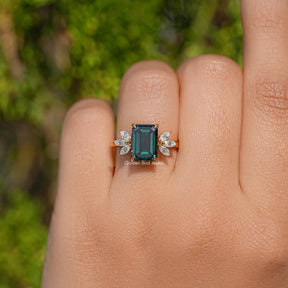 Dark Green Emerald And Marquise Cut Engagement Ring