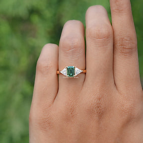 In finger front view of Blue Green Radiant Cut Moissanite engagement ring 