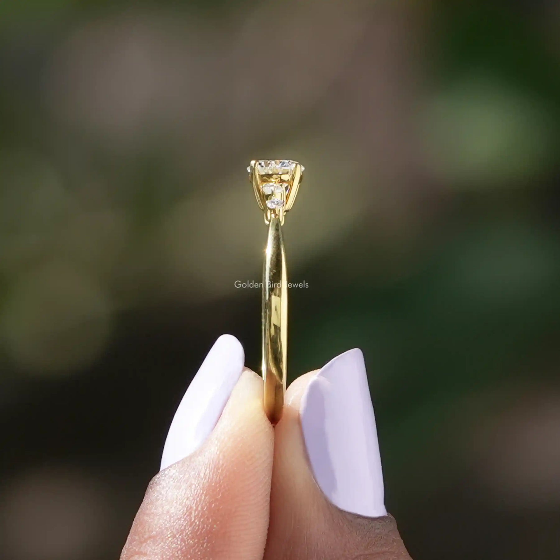 Back view of Five Stone Round Cut Lab Diamond Accent Ring in secure setting 