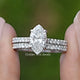Marquise Cut Lab Grown Diamond Bridal Ring Held Between Fingers