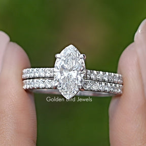 Marquise Cut Lab Grown Diamond Bridal Ring Held Between Fingers