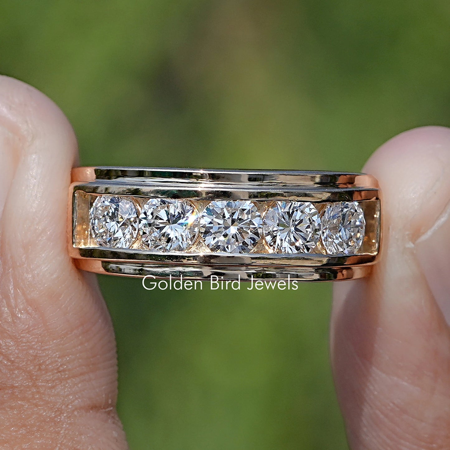 Round Cut Lab Diamond Channel Set Men’s Ring Held Between Fingers