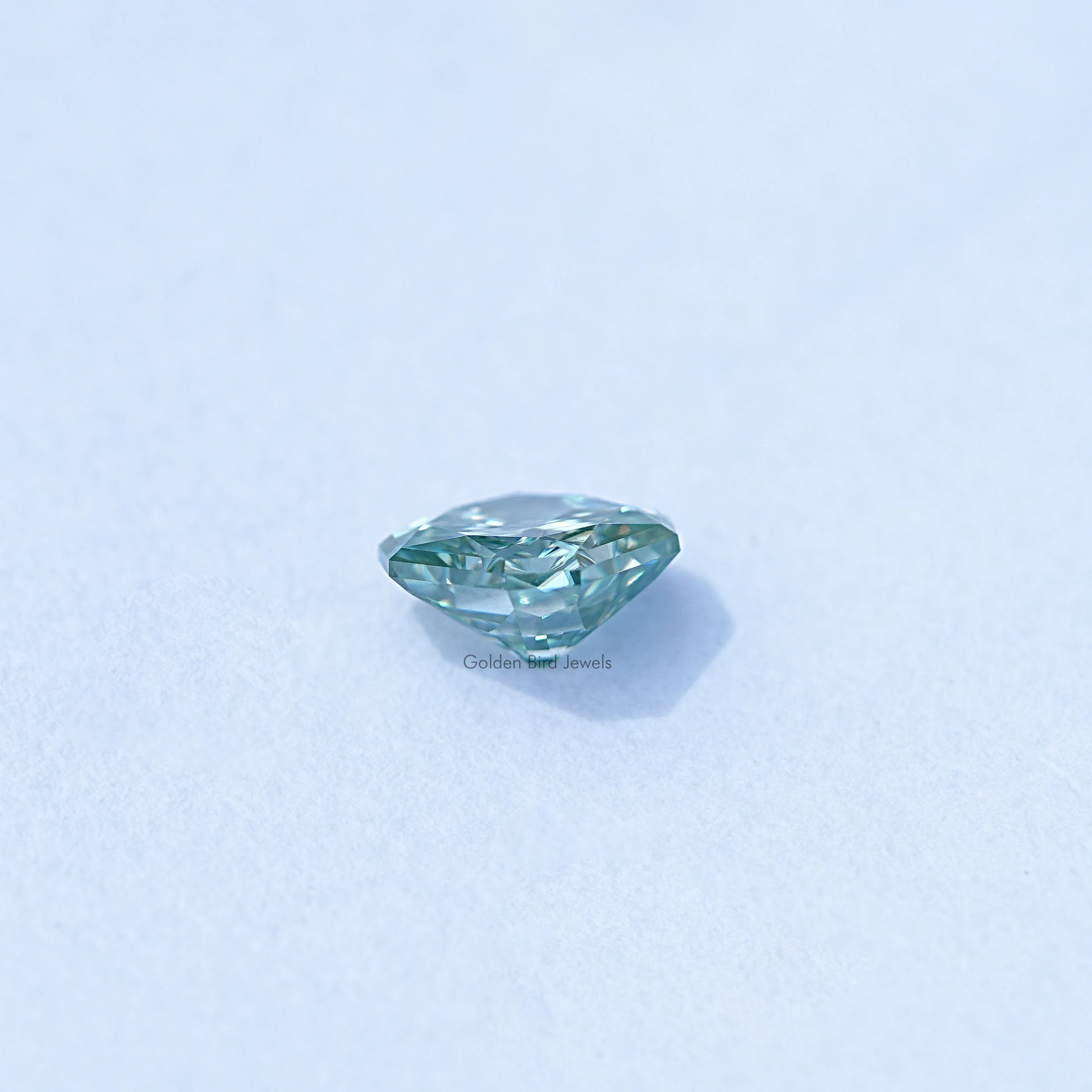 Side view of Green Radiant Cut Loose Stone