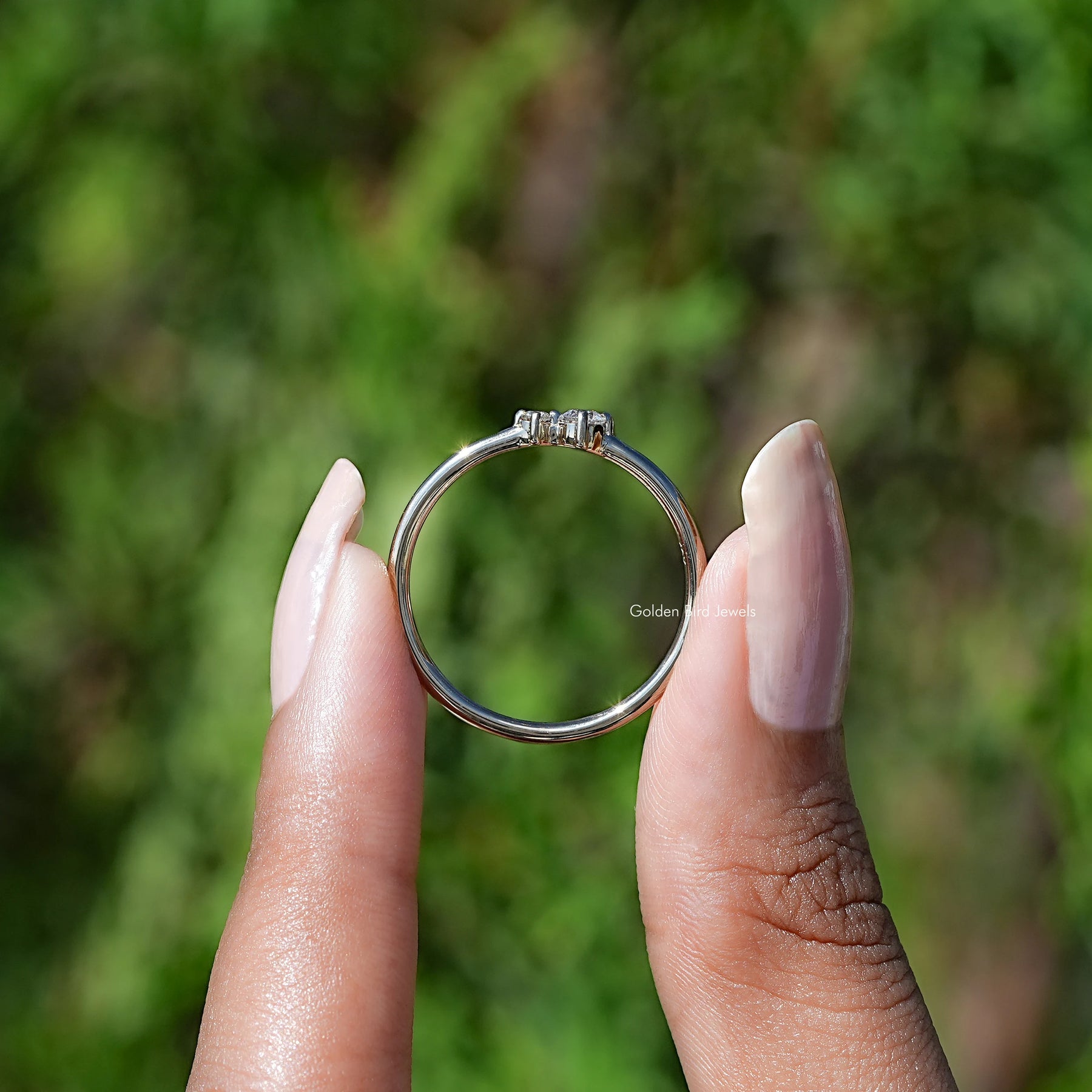 Back View of Round Cut Diamond Solitaire Toi Et Moi Ring In two fingers