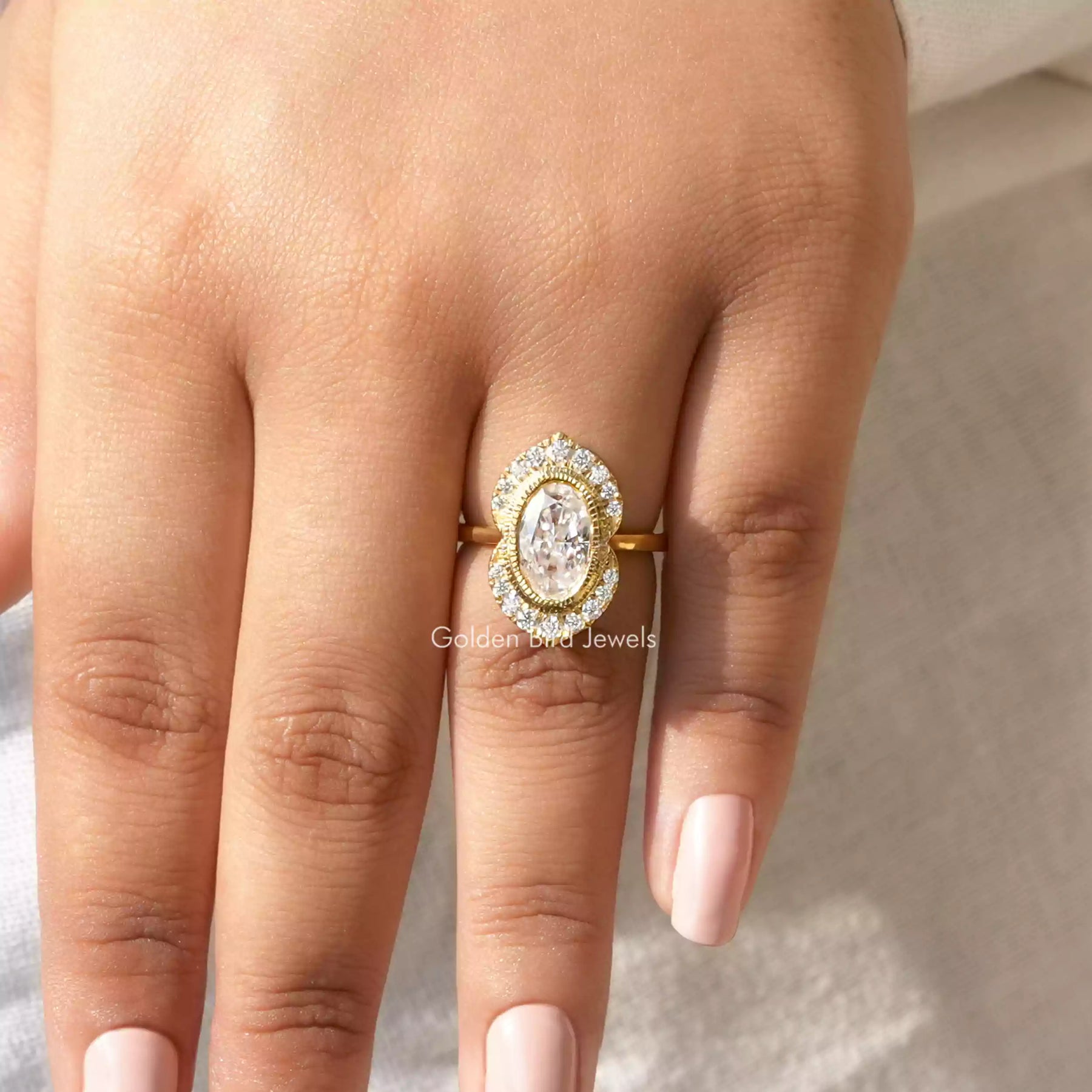 Detailed View Of Crushed Oval Cut Moissanite Engagement Ring  In Yellow Gold