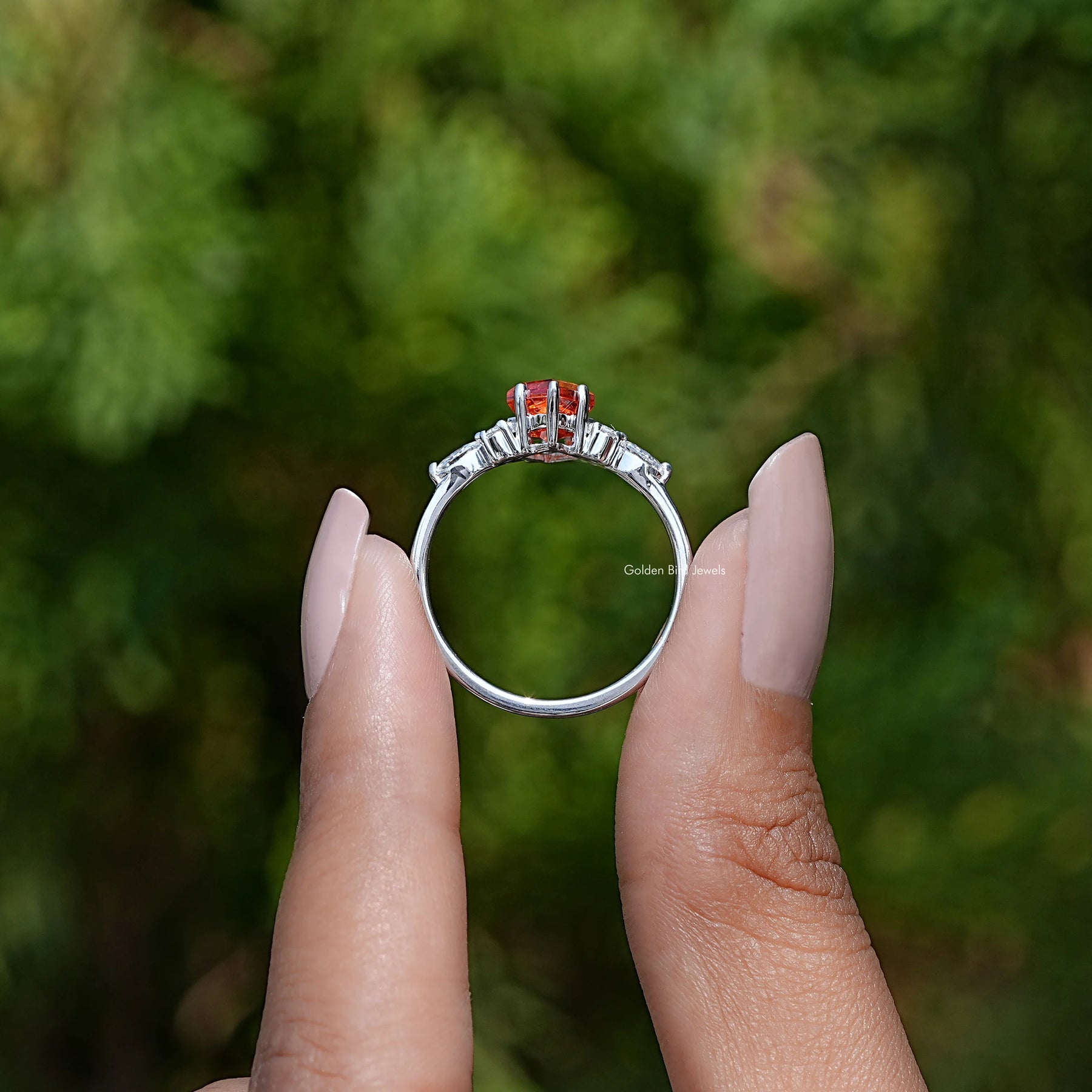 Back View of Kite Cut Gemstone Accent Ring In two fingers