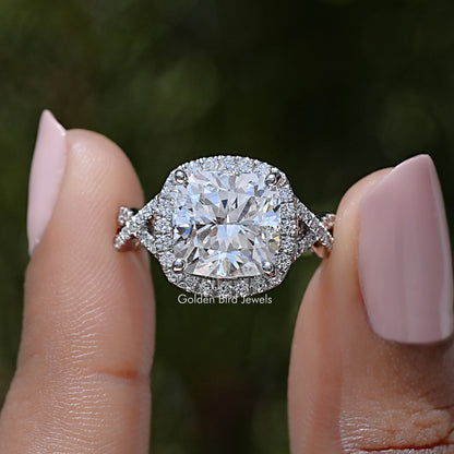 Marquise-style halo engagement ring with large lab diamond center and sparkling side stones