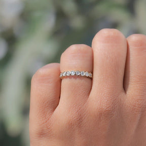 View of Diamond Bezel Set Full Eternity Band In Finger 