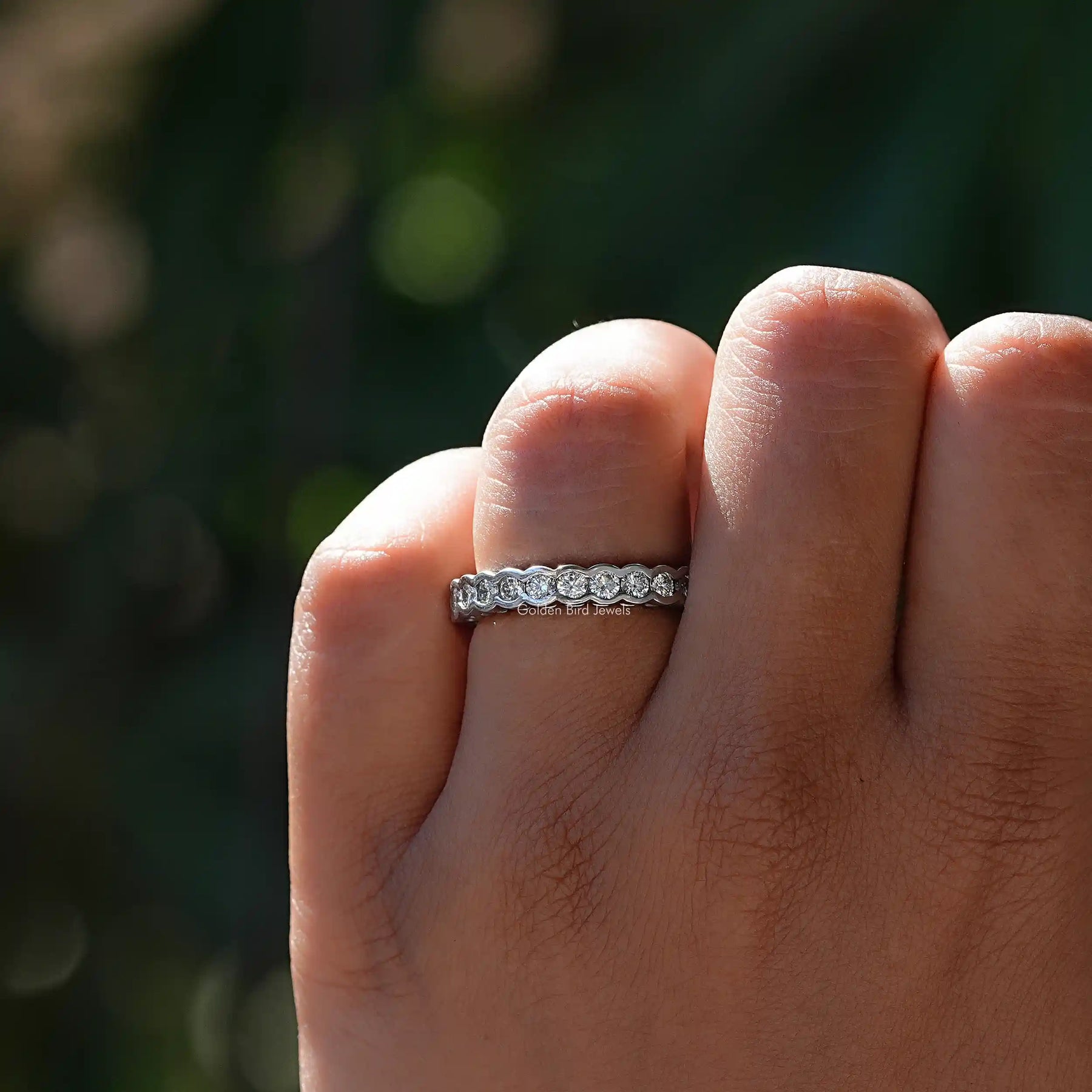 View of Lab Diamond Round Cut Bezel Set Wedding Band  In White Gold