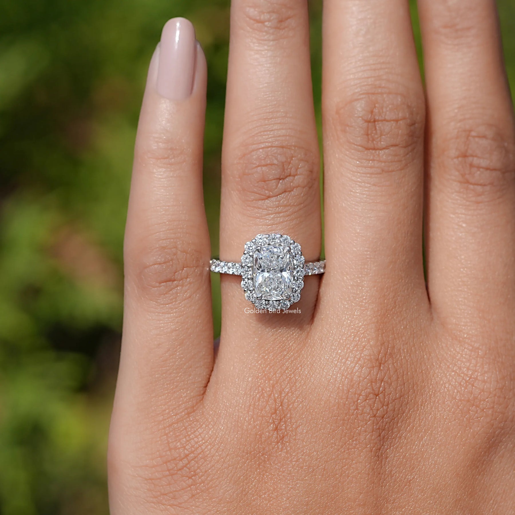 In finger front view of Cushion Lab Diamond Halo Accent Engagement Ring  
